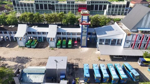 Public transport buses lined up at the transit terminal Stock Footage 346593642