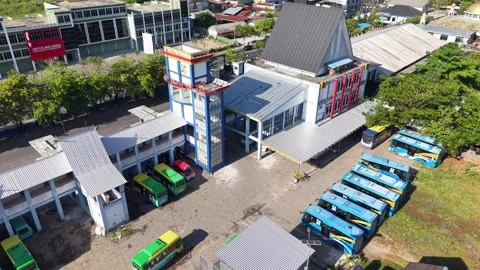 Public transport buses lined up at the transit terminal Stock Footage 346593750