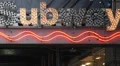 Public Transport Neon Ads Subway Entrance Advertisement Entry Exit Closeup NYC HD Footage