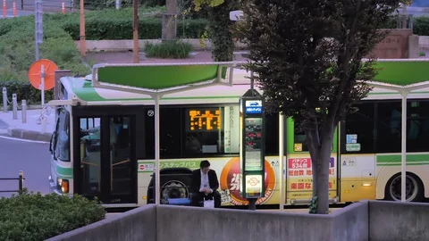 A public transportation bus on the bus stop in Osaka Japan Stock Footage 129275357