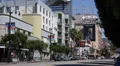 Public Transportation Bus Passing Car Traffic Hollywood Boulevard Los Angeles LA HD Footage