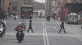 Public transportation downtown street Old Town Bologna Italy car pollution rush HD Footage