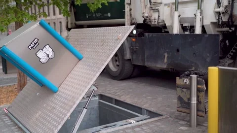 Public trash can opening for garbage truck pickup Stock Footage 280770744