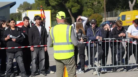 Public Works Worker Briefs Young Visitors in Bordeaux Stock Footage 346348556