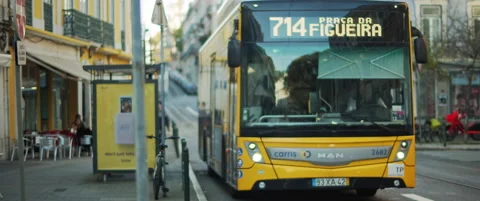 A public yellow bus leaves the station Stock Footage 151402653