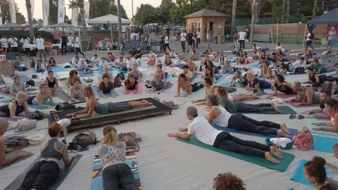 Public Yoga lesson in slow motion Stock Footage 116749348