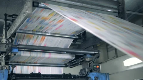 Publishing house unit with paper rolling through the machine. Printing Video stock 111361254