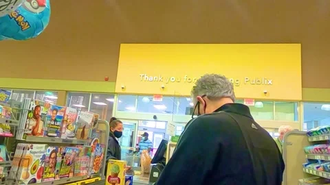 Publix Supermarket store interior manager and cashier wearing face masks Stock Footage 144010422
