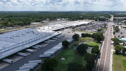 Publix trailers line loading docks at massive distribution warehouse in Stock Footage 339908598