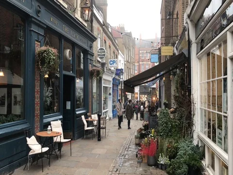 Pubs and shops along Flask Walk, Hampstead, London, UK. Stock Footage 70728317