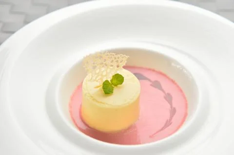 Pudding cake on white plate in restaurant Stock Photos