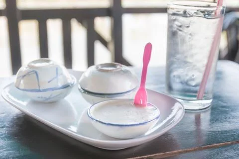 Pudding with coconut topping Stock Photos