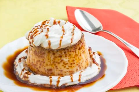 Pudding with cream and syrup Stock Photos