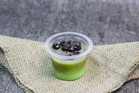 Pudding green tea latte with bubble	 Stock Photos