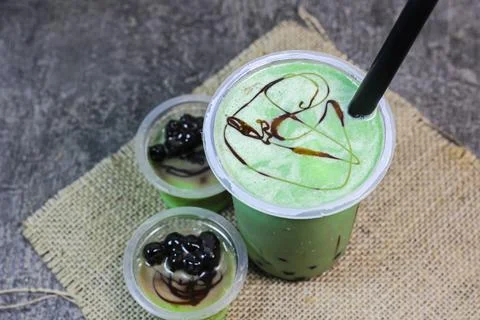 Pudding green tea latte with bubble	 Stock Photos