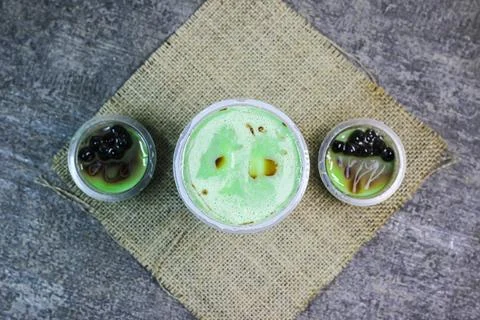 Pudding green tea latte with bubble	 Stock Photos