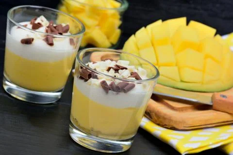 Pudding of mango in a glasses jars Stock Photos