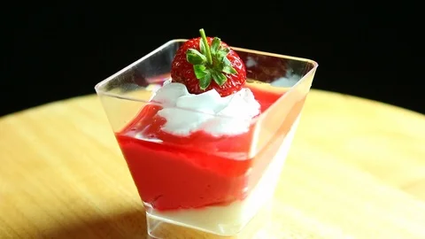 Pudding with strawberry , close up in studio Stock Footage 102547196