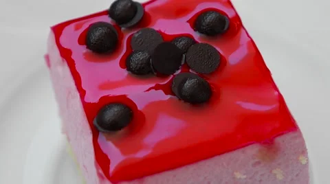 Pudding with strawberry jam and chocolate decoration closeup Stock Footage 54338238