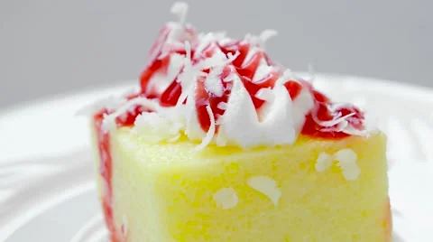 Pudding with strawberry jam and cream on top Stock Footage 54229506