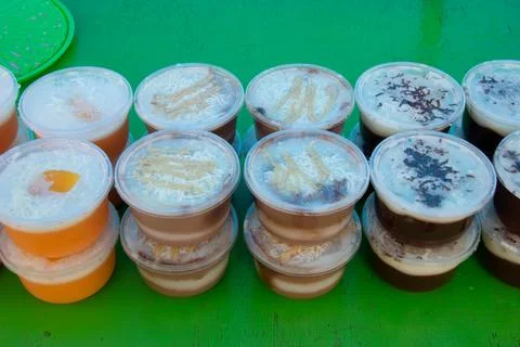 Puddings in plastic containers Stock Photos