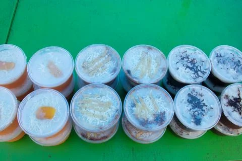 Puddings in plastic containers Stock Photos