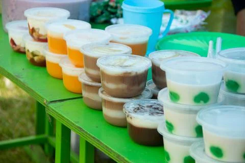 Puddings in plastic containers Stock Photos