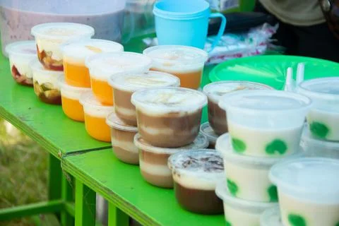 Puddings in plastic containers Stock Photos