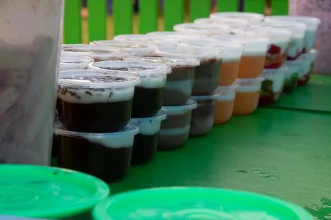Puddings in plastic containers Stock Photos