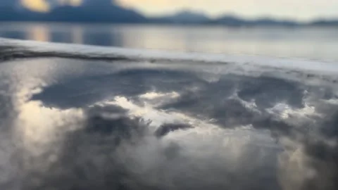 Puddle cloud reflection Stockbeeldmateriaal 337917730