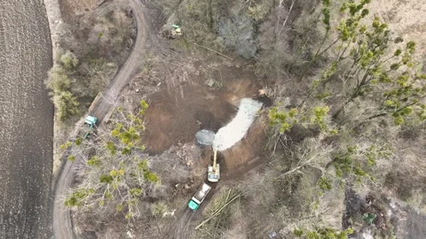 Puddle digger swamp dig excavator heavy duty drone aerial transport clay soil Stock Footage 302443299