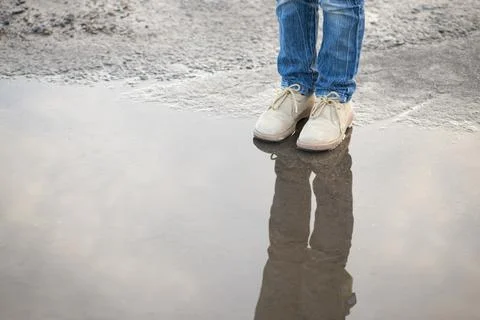 On puddle edge Stock Photos