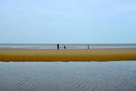 Puddle in front of the sea Stock Photos