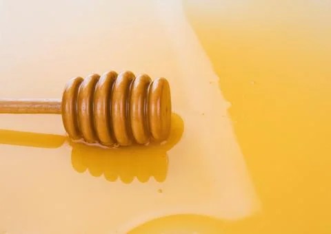 Puddle of honey Stock Photos