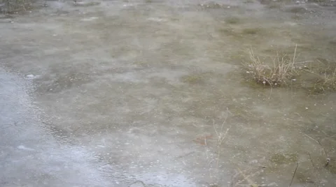 Puddle on ice with water stirred by wind Stock Footage 46205402
