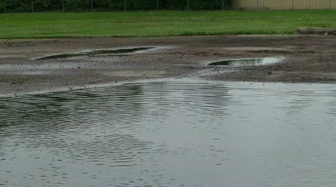 Puddle Jumping - woman splashes Stock Footage 705217