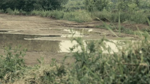 Puddle on the motocross track. Slide camera. Stock Footage 51642739