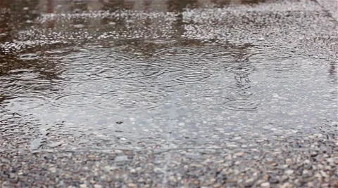 Puddle in a rainy day Stock Footage