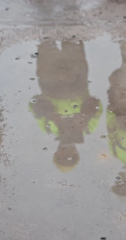 Puddle, reflection and engineer at construction site with meeting, check Stock Footage 340953269