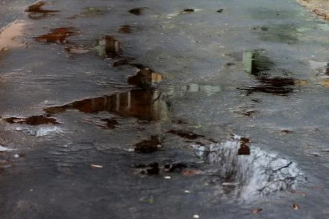 Puddle Reflection on the Asphalt 02 Stock Photos