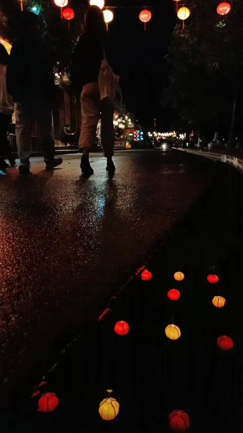 Puddle reflection of multi-colored lanterns in Hoi An old town Stock Footage 247871733