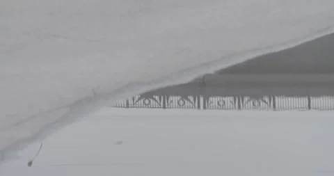 Puddle, reflection of railings and man Stock Footage 270539854