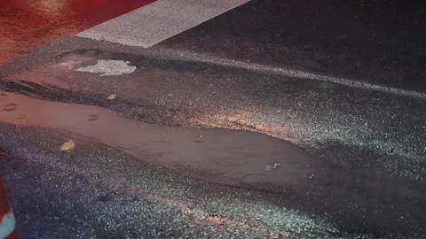 Puddle reflection on a rainy Bangkok road Stock Footage 345860214