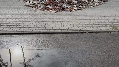 From puddle reflection to ruined house Stock Footage 221644293