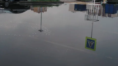 The puddle on the road, in which the sky reflects Stock Footage 93448849
