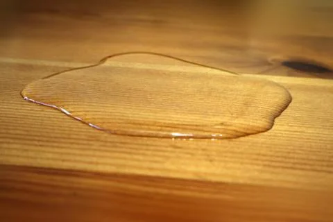 Puddle on the surface of clear water macro photography as background. Stock Photos