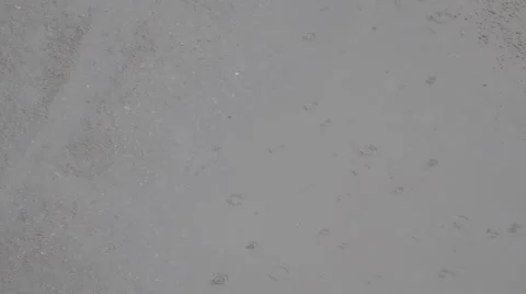 Puddle of water in rain - selective focus Stockbeeldmateriaal 50068217