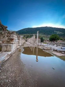 Puddles Mirror Fallen Columns Across Ephesus Roman Agora Path 스톡 사진