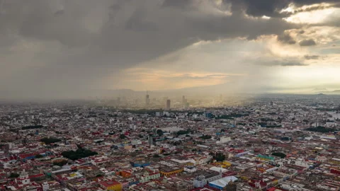 Puebla City at Sunset with Dramatic Cloudscape. Aerial Hyperlapse. Stock Footage 317963724