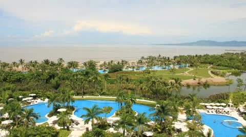Puerto Vallarta Resort pool, clouds, people and beach time lapsed Stock Footage 11979854